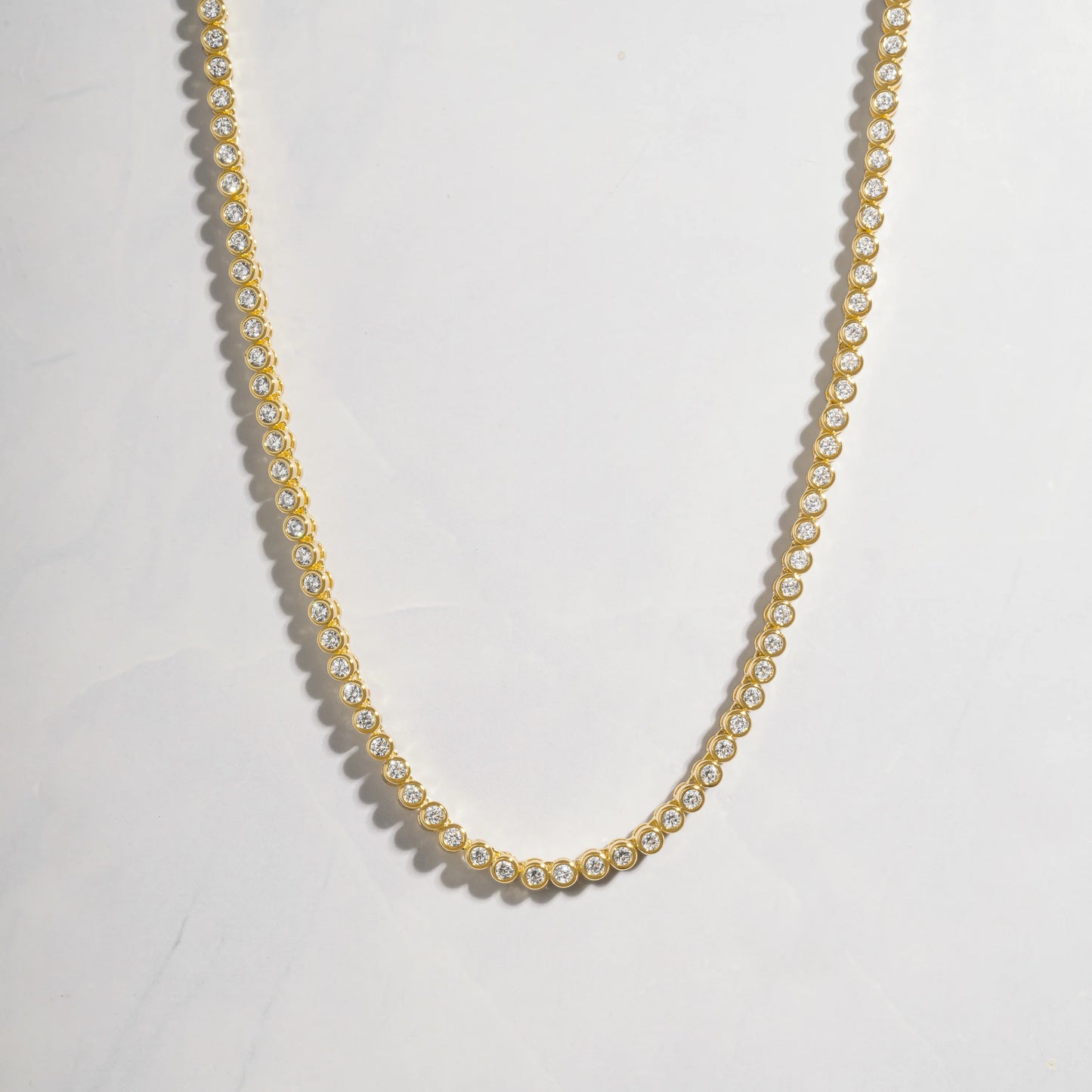 Gold bezel tennis necklace