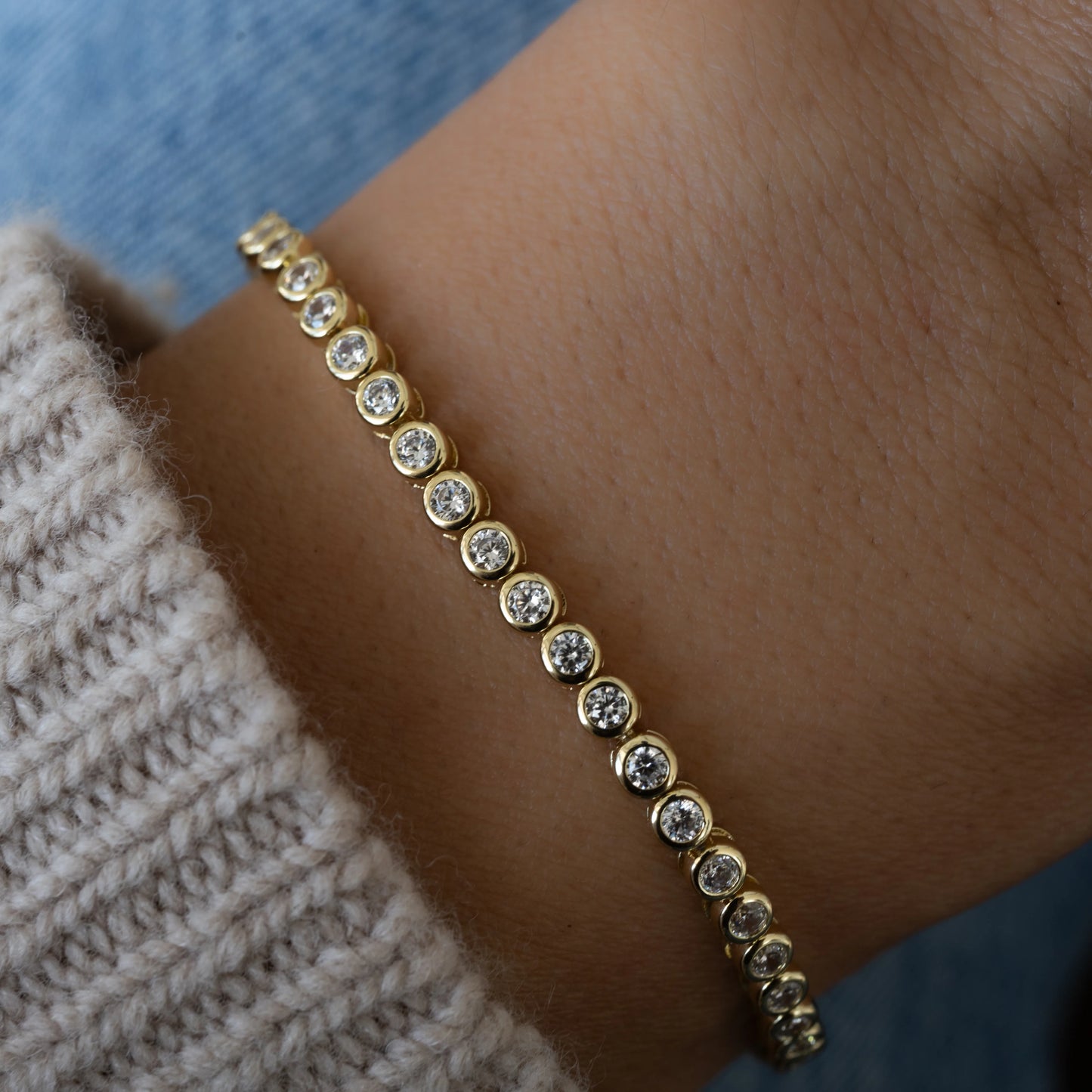 Gold bezel tennis bracelet 6.75”